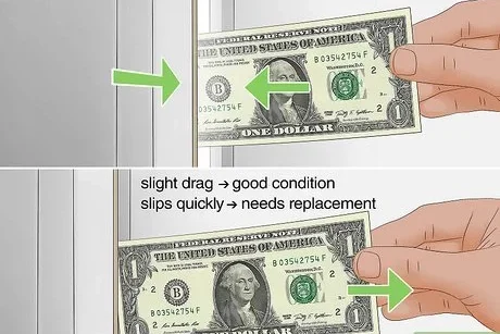 checking fridge seal with paper bill