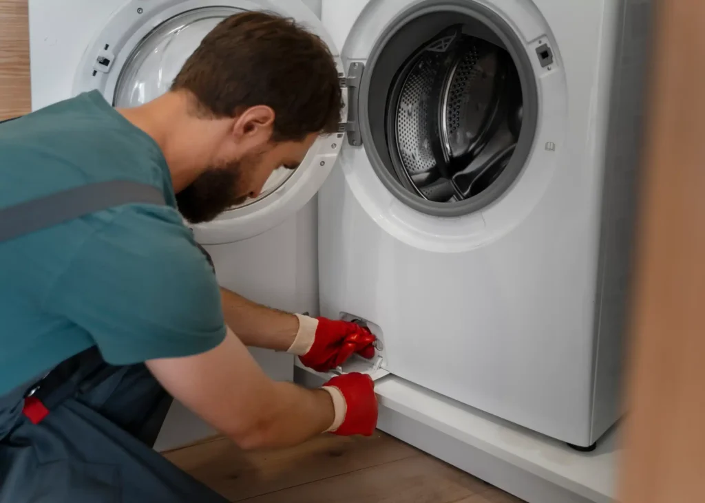 technician or a homeowner, inspecting or repairing a front-load washing machine