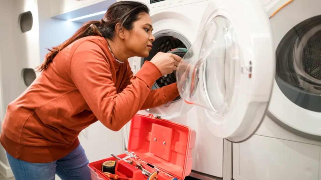 a girl doing a DIY on her washer