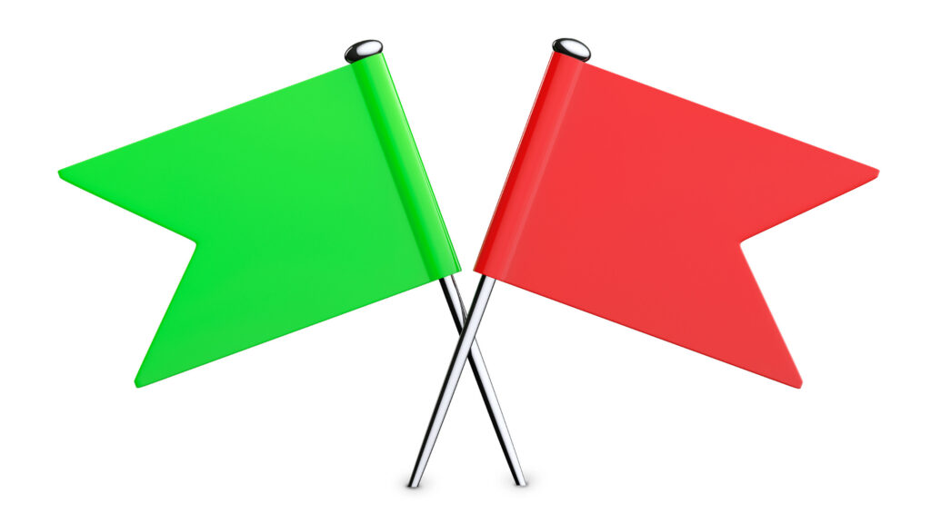 two flag pins, one red and one green