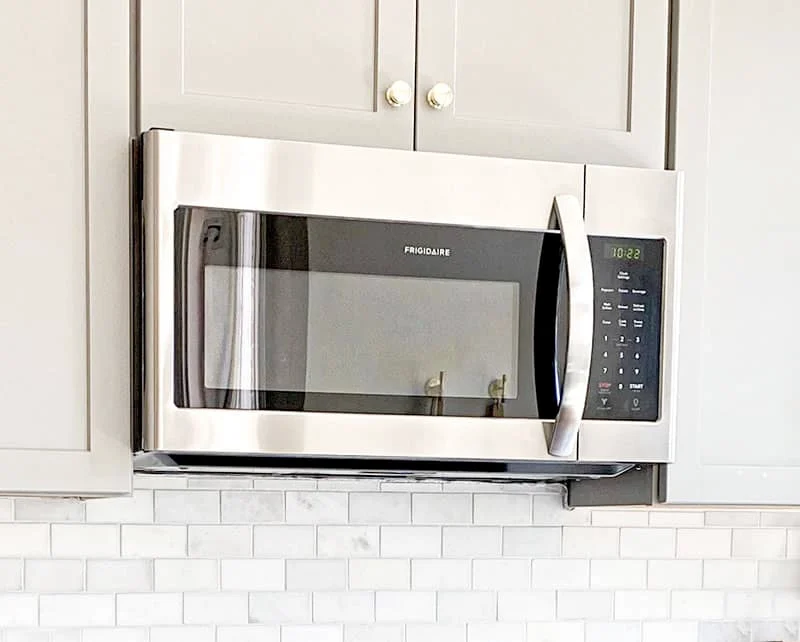 a stainless steel Frigidaire over-the-range microwave oven