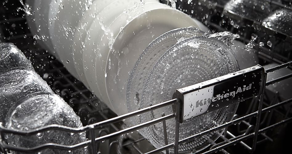 the interior of a KitchenAid dishwasher during a wash cycle