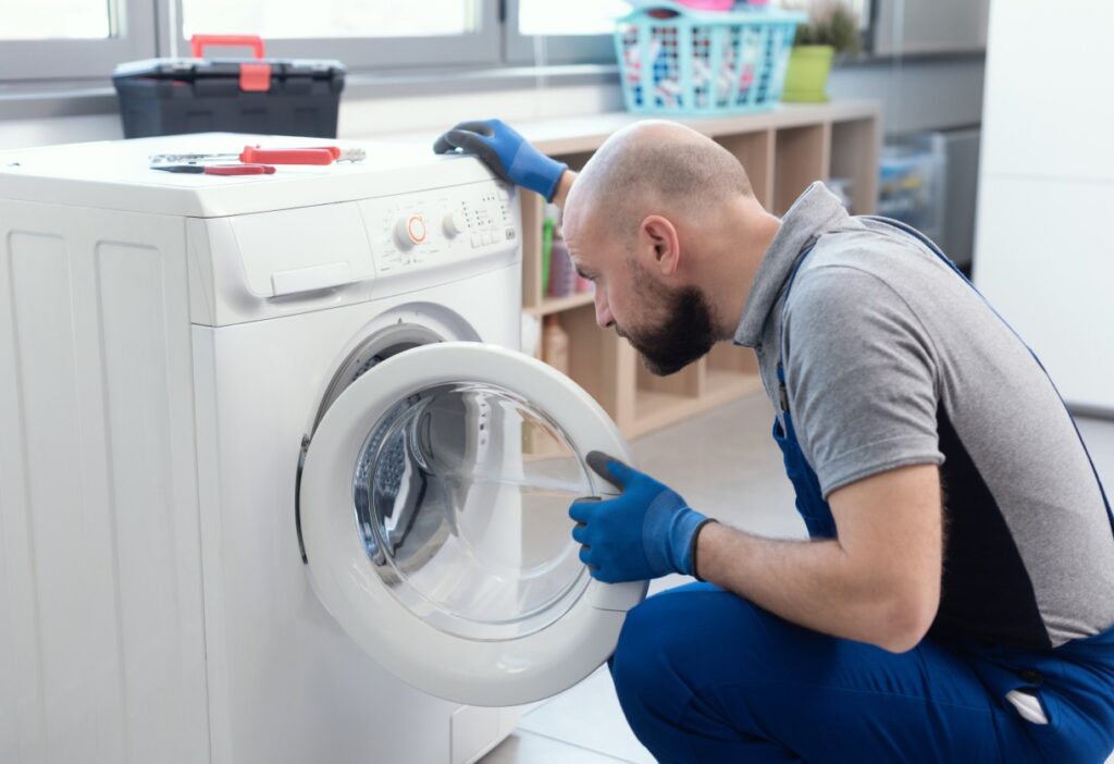 Technician checking the issue of the washer
