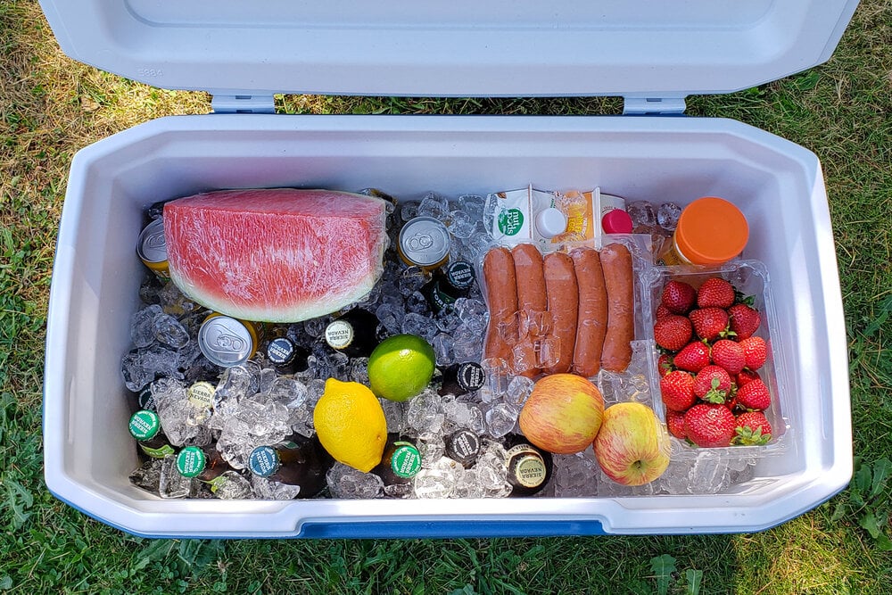 an open cooler packed with various food and drinks