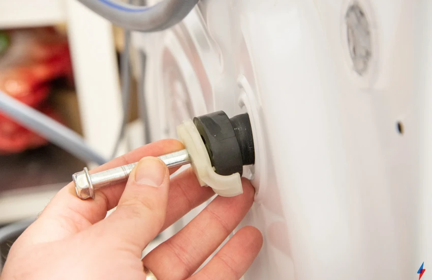 a person installing a washing machine drain hose connection