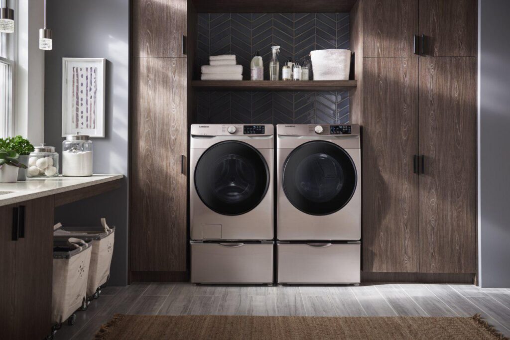 a set of Samsung front-load washer and dryer units in a laundry room setting