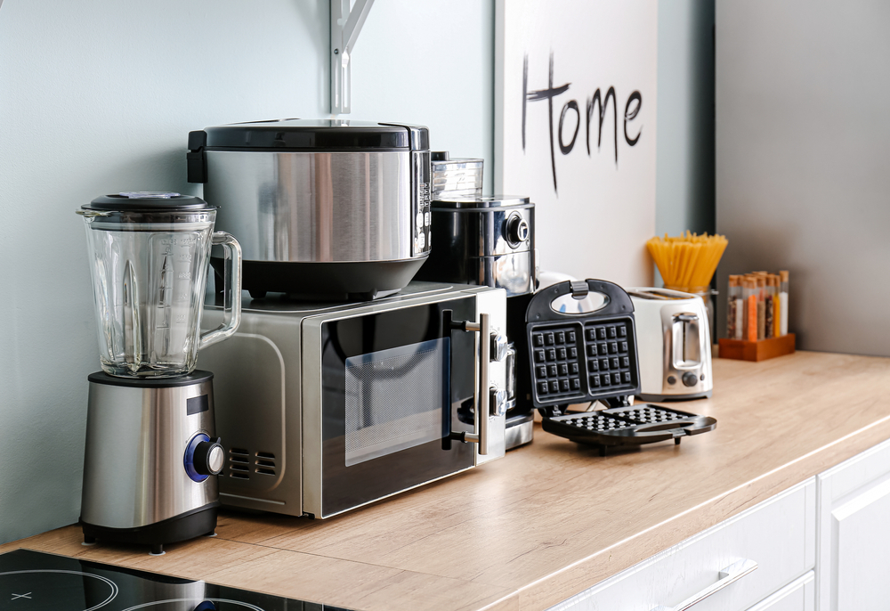 a collection of small kitchen appliances on a countertop