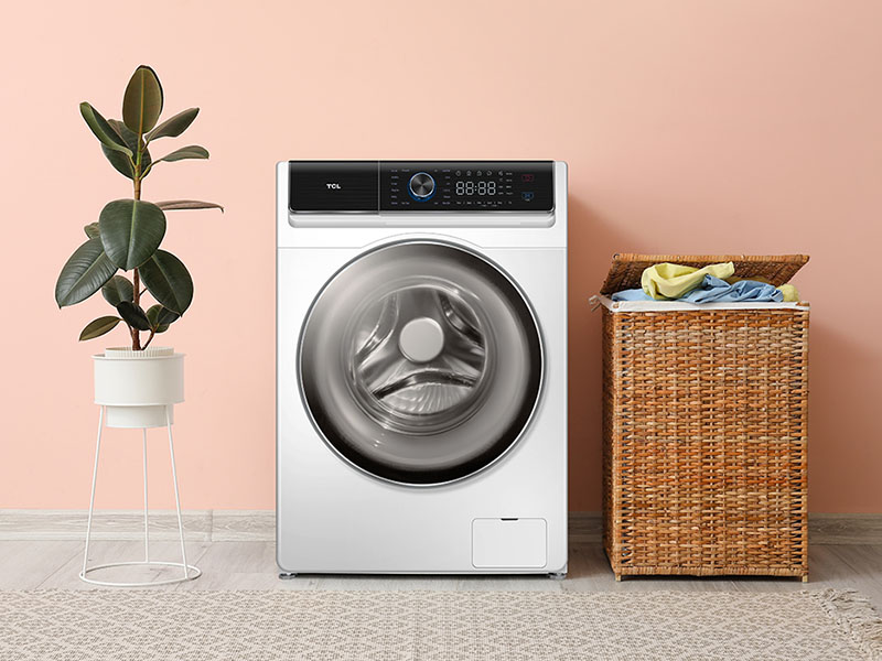 Washing machine and basket with laundry near color wall