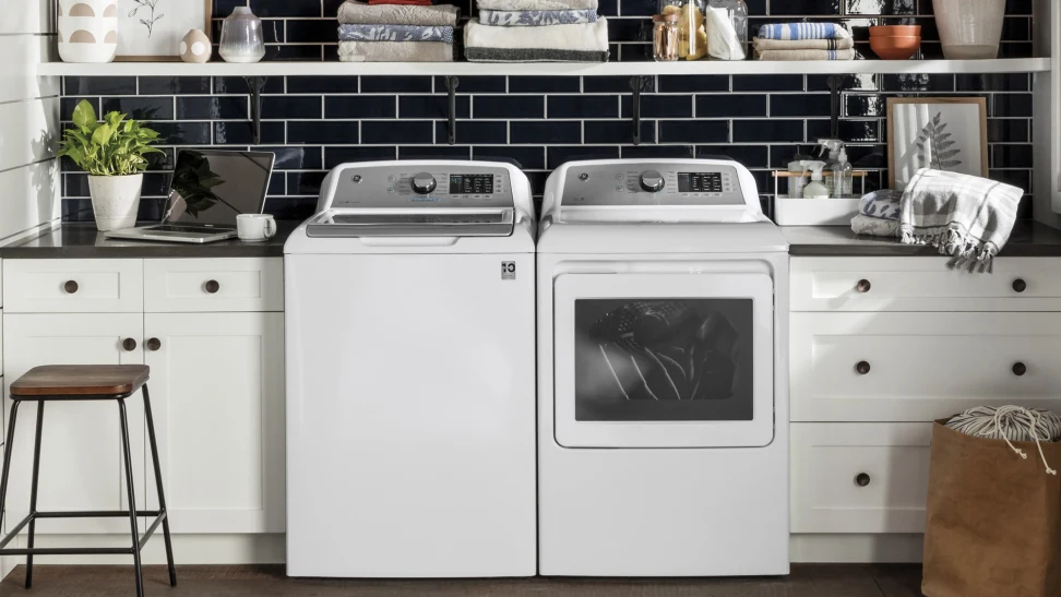 a GE top-load washer and electric dryer pair. The dryer is likely a GE 7.4 cu. ft. electric dryer, such as model GTD58EBSVWS