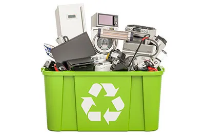 a collection of electronic waste, also known as e-waste, in a recycling bin