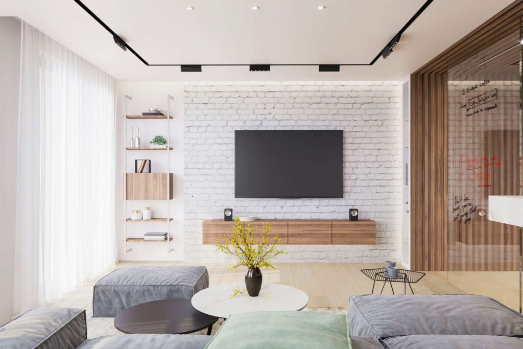 a modern living room with a white brick accent wall and a wall-mounted television